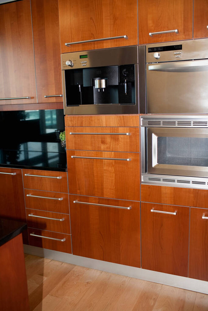 modern kitchen interior with white cabinets and wooden floor - Fotografie, Obrázek