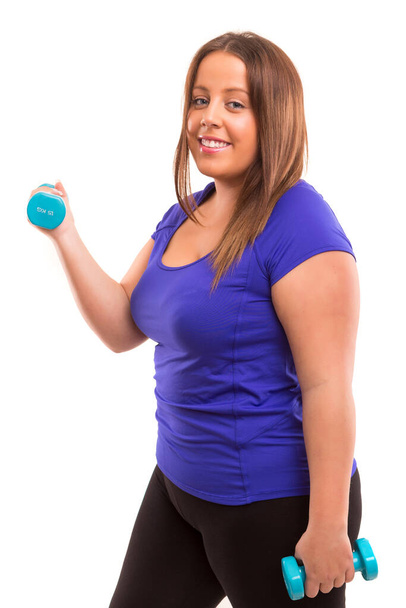 young beautiful woman with dumbbells on white background - Photo, Image