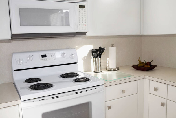 modern kitchen with appliances and a large window - Zdjęcie, obraz