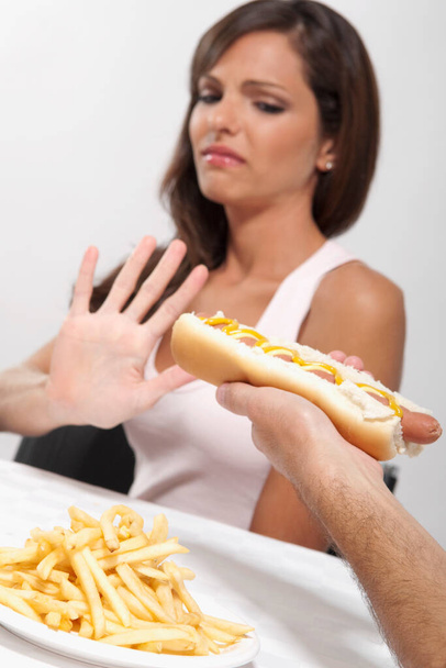woman eating burger with fries - Photo, image