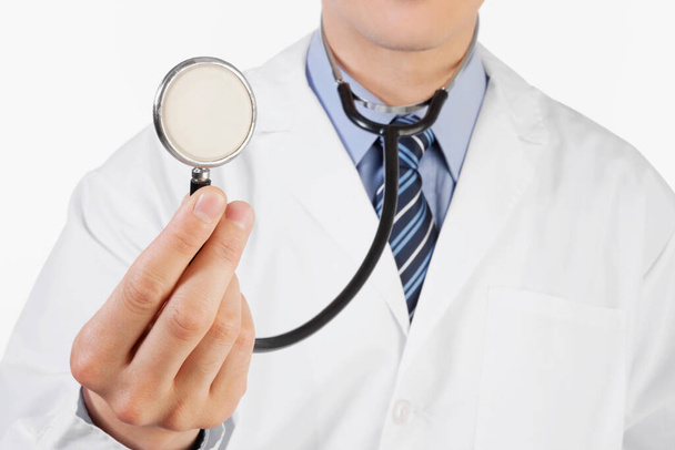 doctor holding a stethoscope isolated on white background - Foto, Imagem