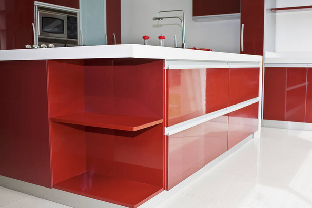 modern kitchen interior with red and white sink - Foto, Bild