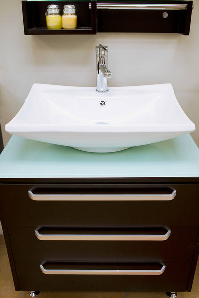 modern bathroom sink with white bathtub and faucet - 写真・画像