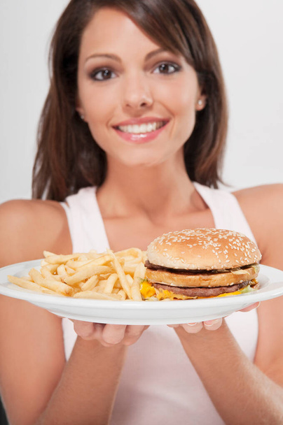 beautiful woman with burger and hamburger - Foto, Imagen