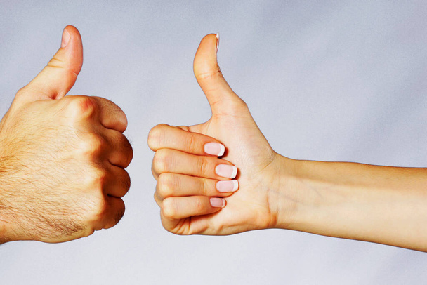hand showing thumbs up sign on white background - Foto, Imagem