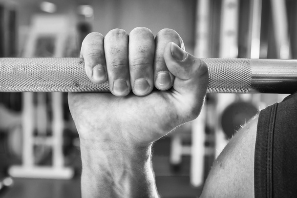Strong hand holding barbell - Foto, immagini