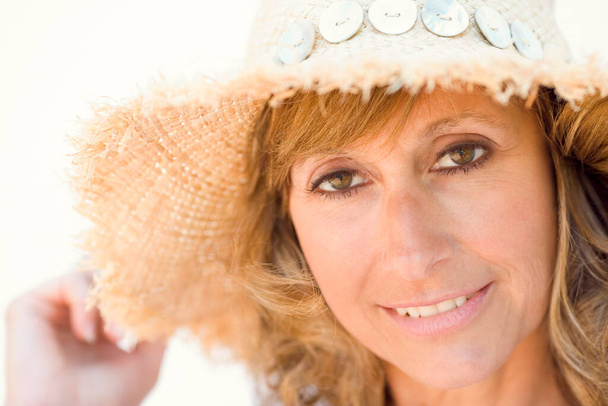 portrait of a beautiful woman in hat - Photo, image