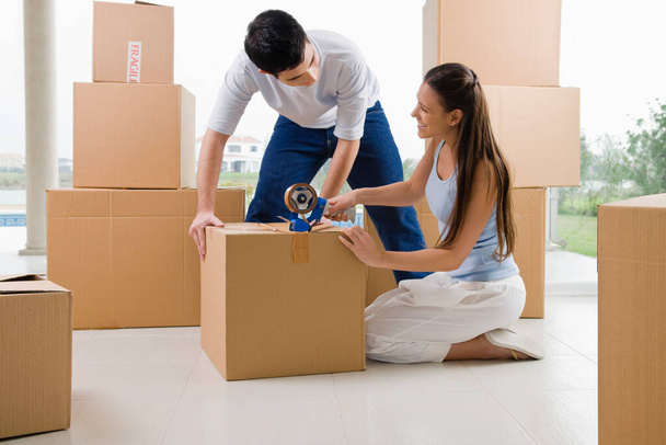 young couple moving to new home - Photo, Image