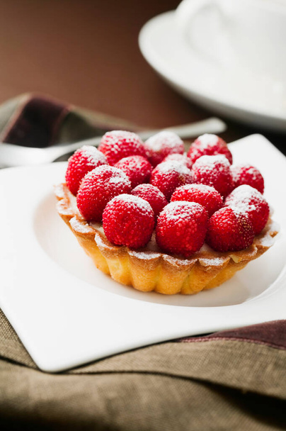 delicious homemade cake with berries on white plate - Foto, immagini