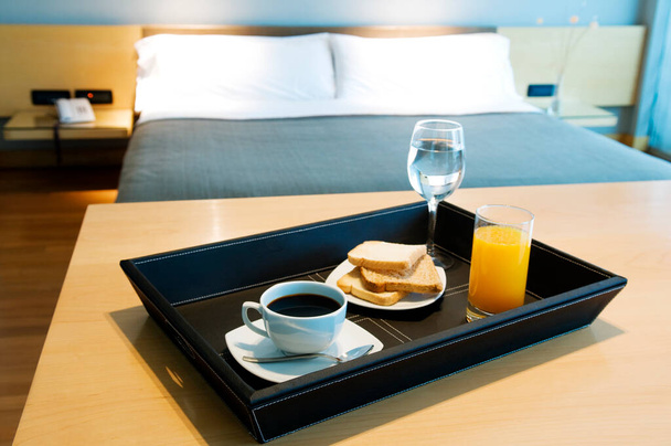 breakfast, coffee, croissant, orange juice, cup, tea, towel, glasses, on the bed - Φωτογραφία, εικόνα