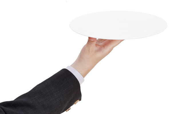 vista superior de la mano con plato blanco plano vacío
 - Foto, imagen