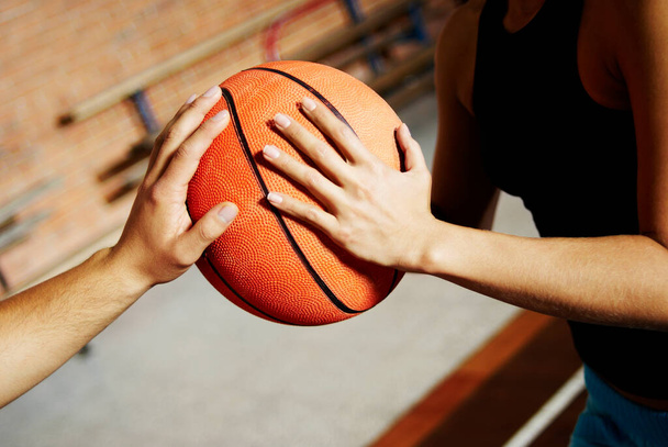 close up of a basketball player holding a ball - Foto, imagen