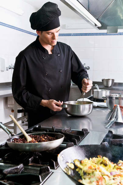 chef cooking dish in the kitchen - Fotoğraf, Görsel