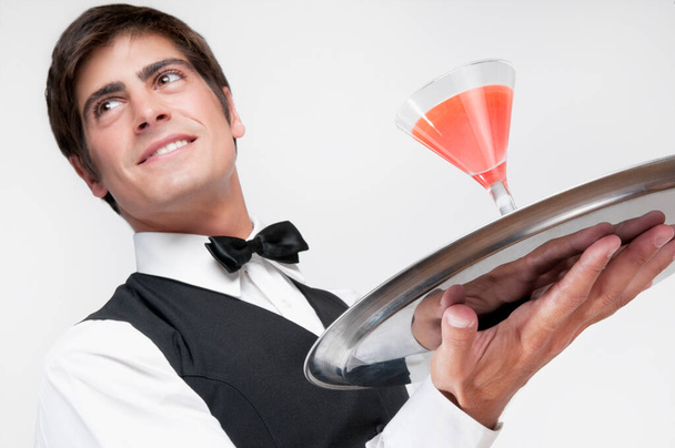 waiter with a glass of wine and a bottle of champagne - Photo, Image