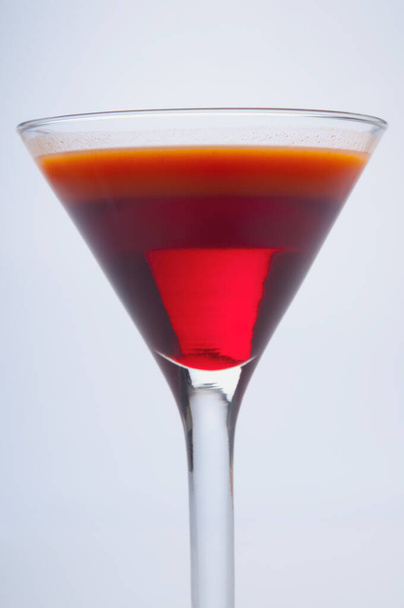 red cocktail with a glass of wine on a white background - Foto, Imagem