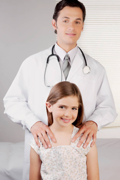 doctor and nurse examining little daughter in hospital - Фото, зображення