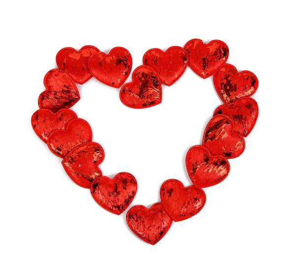 red textile small hearts on a white background, festive background, shape heart - Foto, Imagen