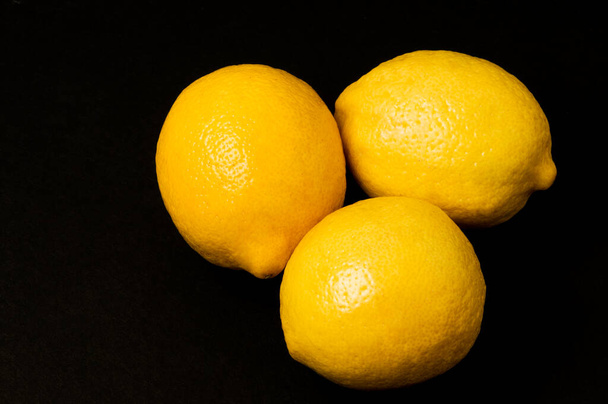 lemon on a black background - Photo, image