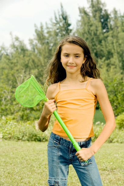 young woman with a broom - Фото, зображення