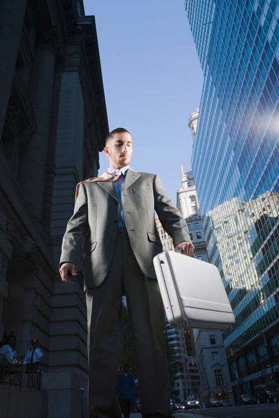 businessman in suit and tie standing on stairs - Fotó, kép