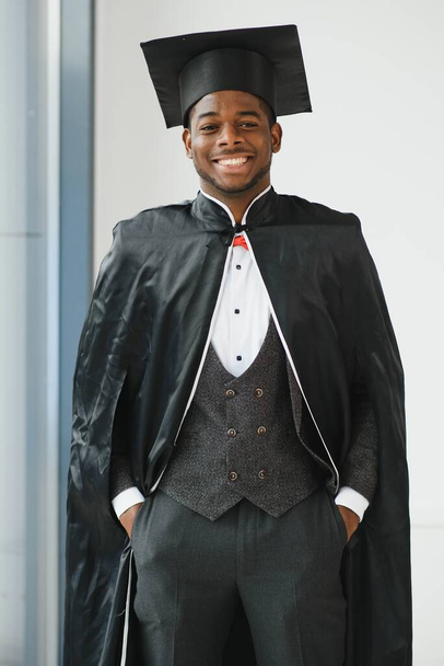 happy african american law school graduate on graduation day - 写真・画像