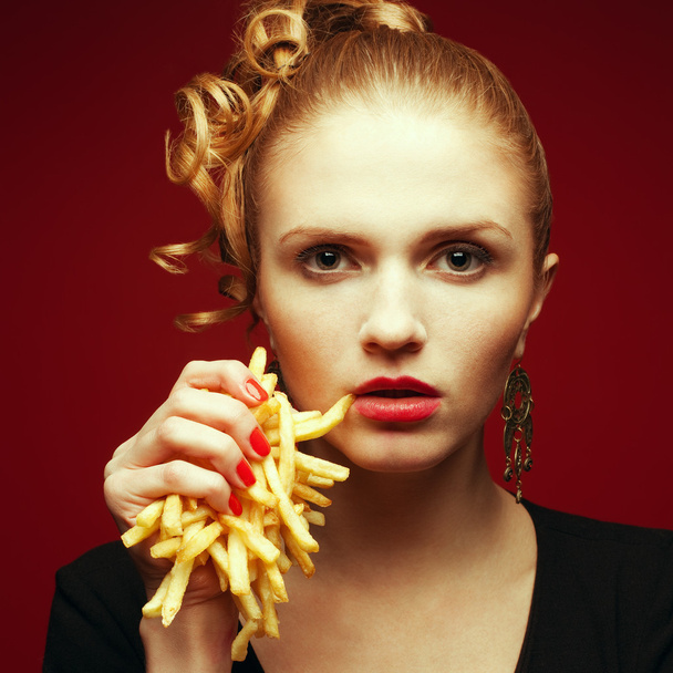 Unhealthy eating. Junk food concept. Portrait of fashionable you - 写真・画像