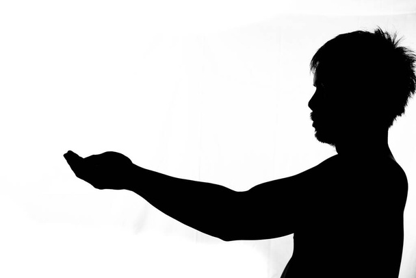 Side image half shadow of a man. silhouette of a man on a white background - Fotoğraf, Görsel