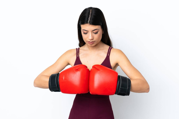 Young sport woman over isolated white background with boxing gloves - Fotoğraf, Görsel