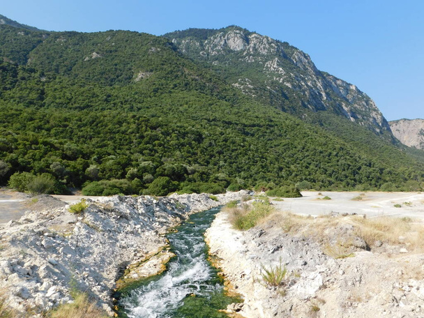 Thermopylae, Greece. View of a stream of sulfur rich thermal water flowing through the battlefield of the famous 480 BC battle - Photo, Image