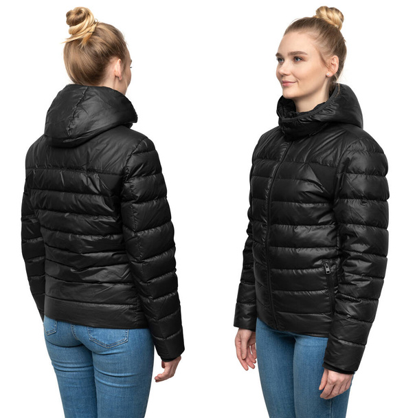 Young female model posing in black down jacket isolated on white background. Winter and autumn women down jacket mockup - Photo, Image