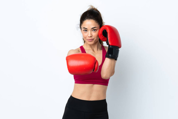 Sport woman over isolated white background with boxing gloves - Foto, imagen