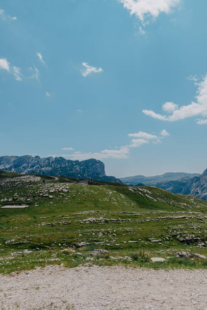 Amaizing view on Durmitor mountains, National Park, Mediterranean, Montenegro, Balkans, Europe. Bright summer view from Sedlo pass. The road near the house in the mountains. - Foto, Imagen