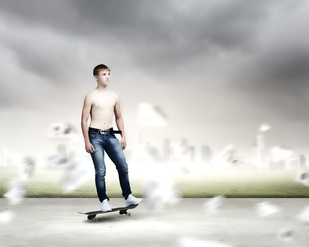 Teenager on skateboard - Фото, зображення