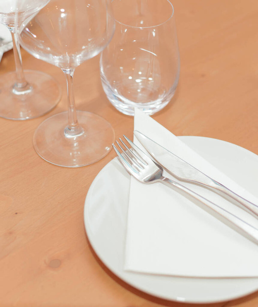 plate, cutlery and glasses set for an elegant dinner - Photo, Image