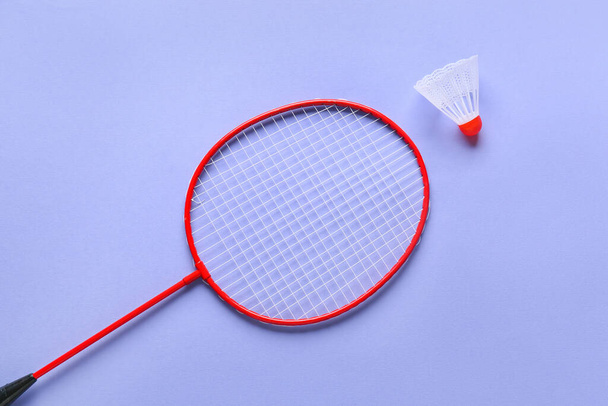 Badminton racket and shuttlecock on color background - Фото, изображение