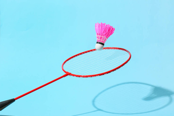 Badminton racket and shuttlecock on color background - Photo, Image