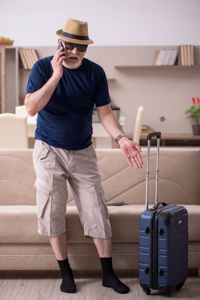 Old man preparing for trip at home - Photo, Image