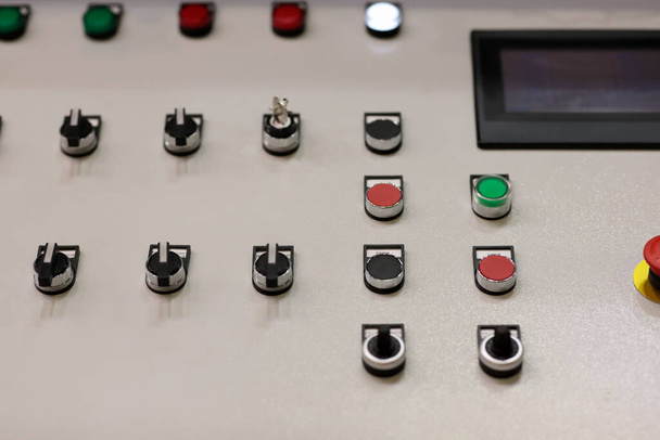 Pushbuttons, switches, and touchscreen on the control panel. Selective focus. - Photo, Image