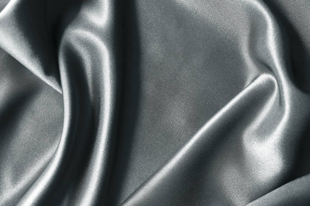 ドレープグレーの背景の抽象的な質感。美しい織物の背景です。接近中だ。トップ表示 - 写真・画像