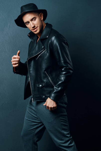 handsome man wearing hat leather jacket fashion modern posing style - Photo, Image