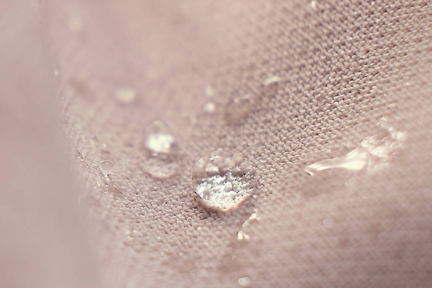 water beading on fabric. Waterproof coating background with water drops. soft focus, blur - Photo, Image