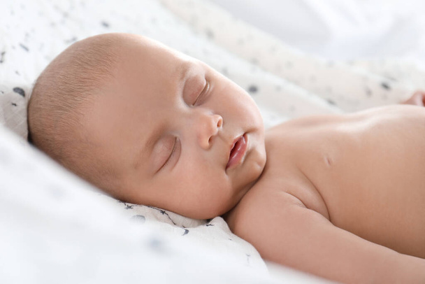 Cute little baby sleeping on bed, closeup - Photo, Image