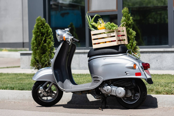 Box with vegetables on scooter outdoors  - Fotografie, Obrázek