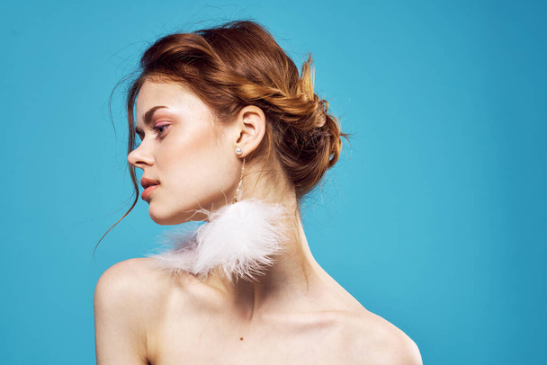 attractive woman with  naked shoulders with  fluffy earrings  - Photo, image