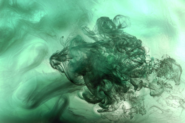 Green smoke cloud underwater background. Abstract swirling ocean, vibrant emerald color silk. Concept hookah, perfume, aroma wallpaper - Фото, изображение