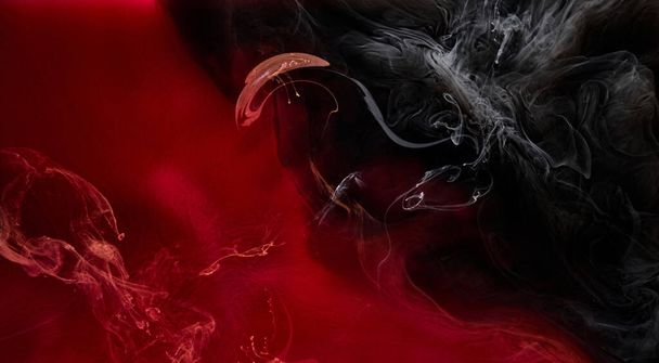 Red black pigment swirling ink abstract background, liquid smoke paint underwater - Fotoğraf, Görsel