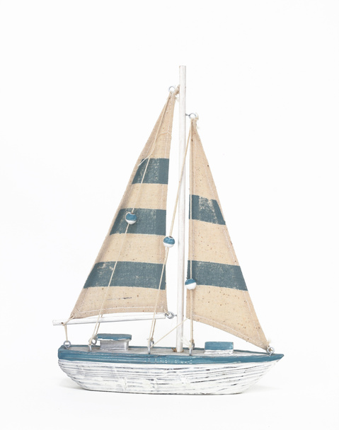 Wooden toy sailing boat on white background - 写真・画像