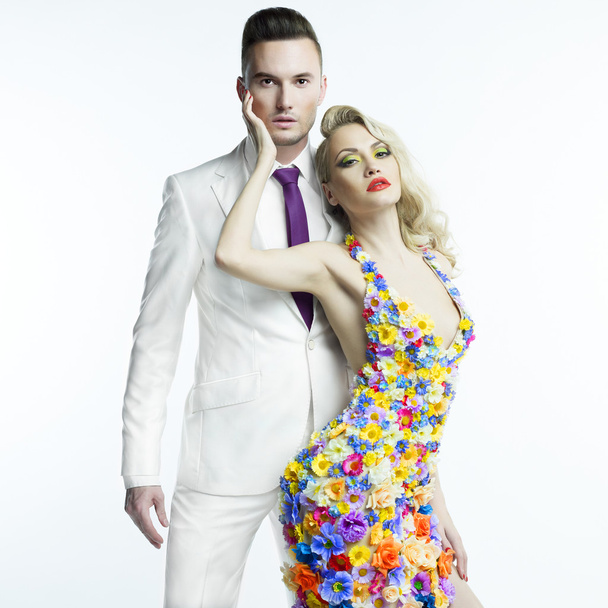 Young man and beautiful lady in flower dress - Foto, Bild