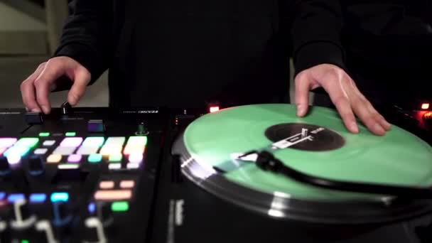 Close up of DJ at work, mixing, spinning and scratching on a turntable. Art. Professional equipment details for creating techno electro music. - Footage, Video