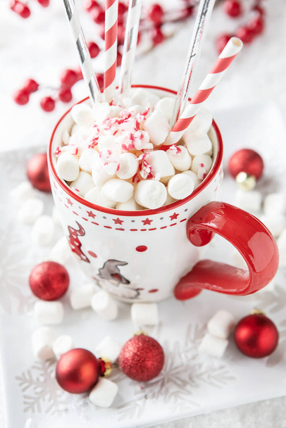 Cup of creamy hot chocolate with melted marshmallows    for christmas holiday , close-up with selective focus and  shallow depth of fiel - Foto, Imagen